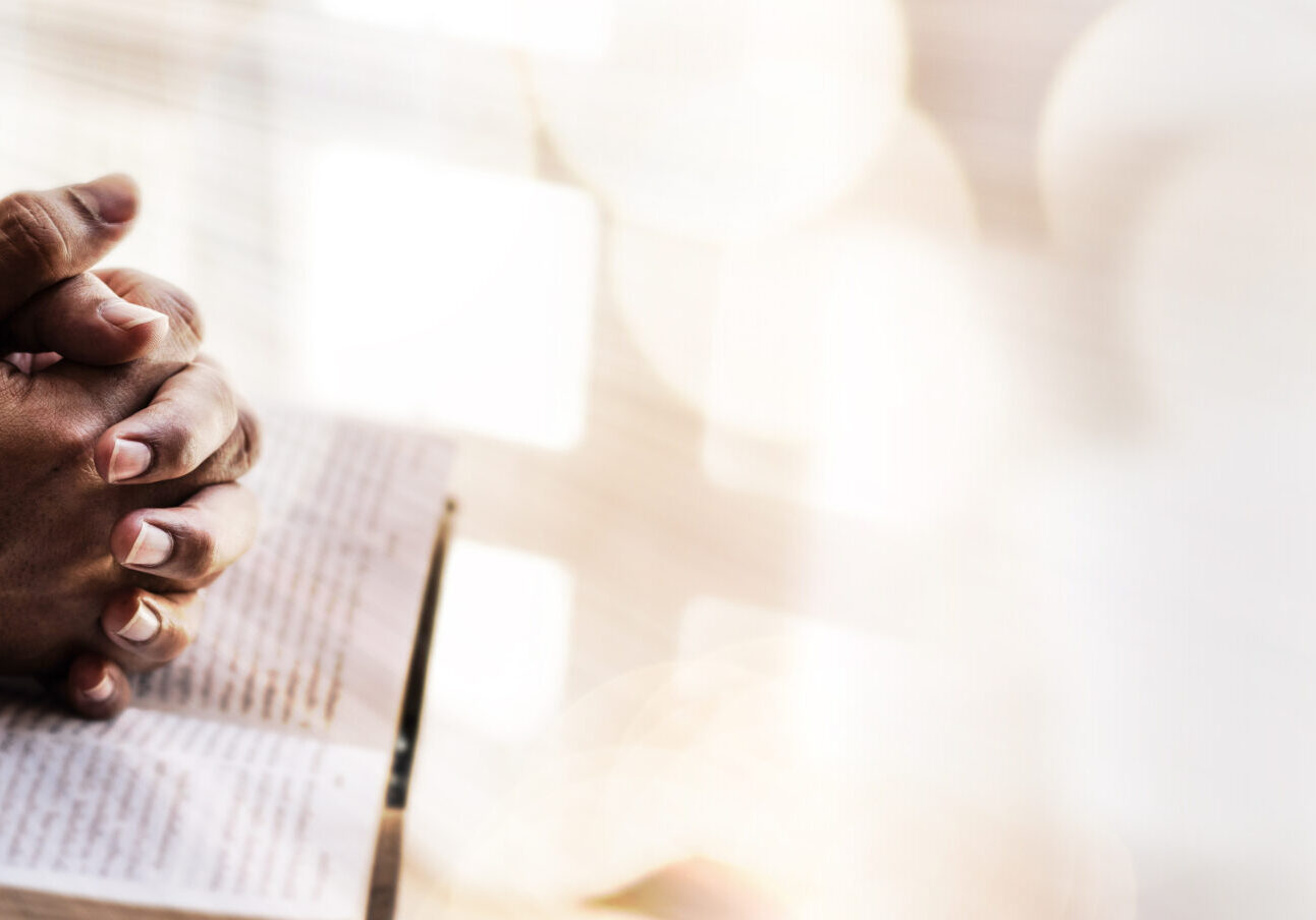 Man hands pray on bible. Concept of hope, faith, christianity, religion, church online.